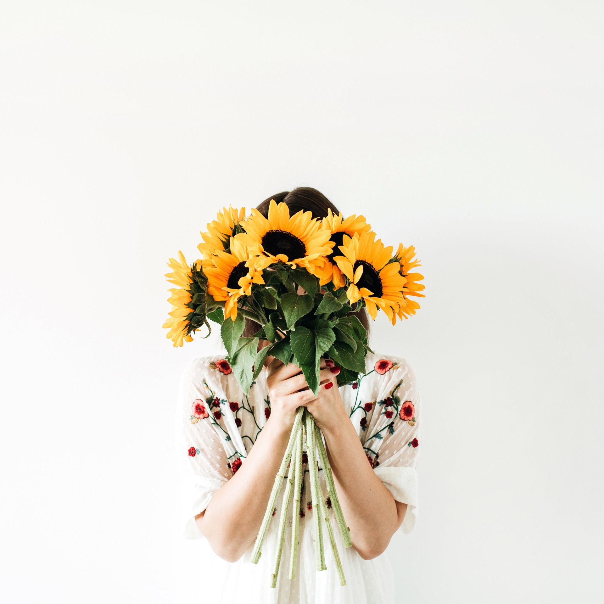 Girl Holding Sunflower Bouquet